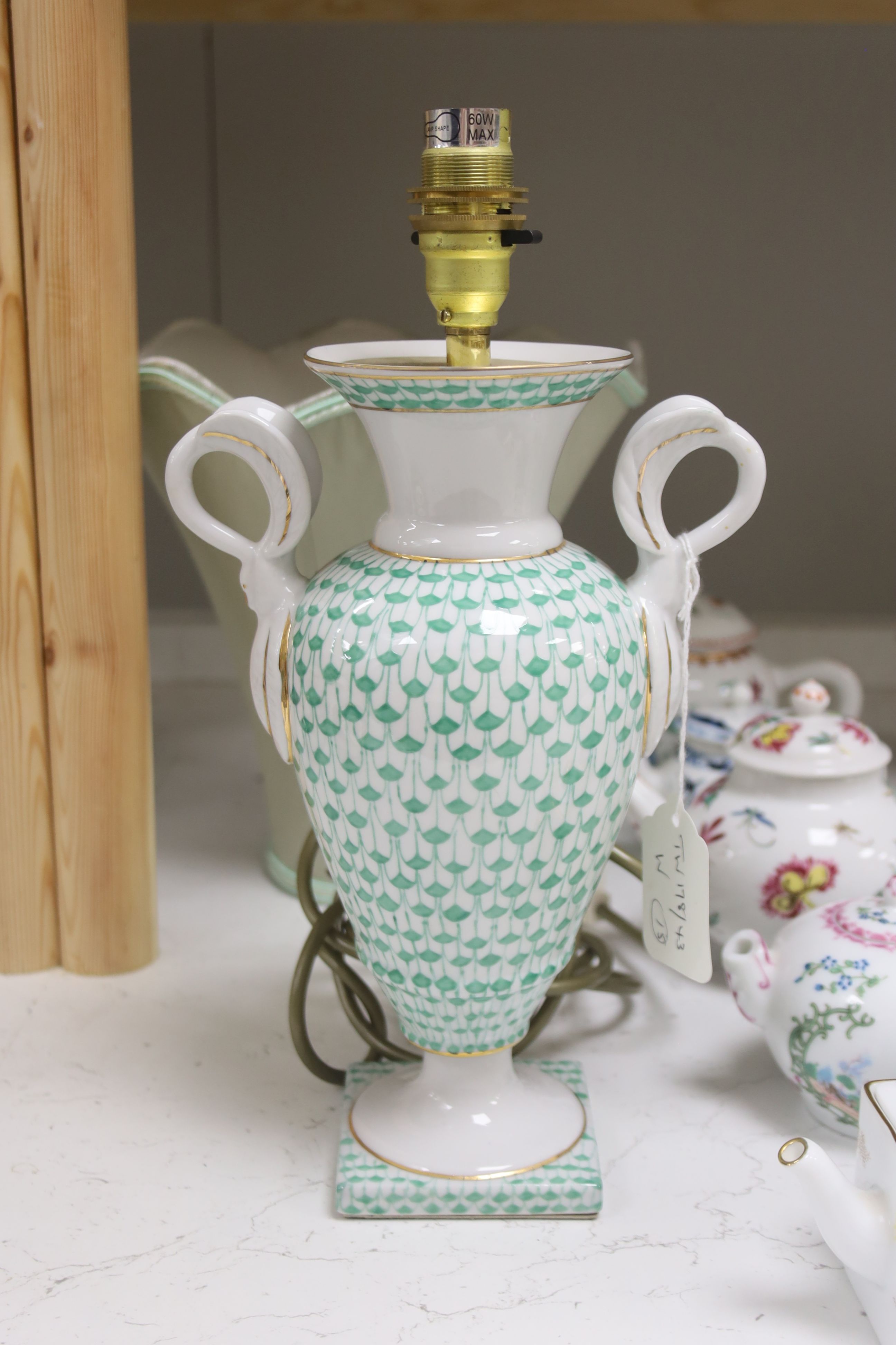 Twelve modern floral-decorated collectors' teapots (V&A Museum Collection), a Spode dish, a table lamp and a Herend duck group (15)